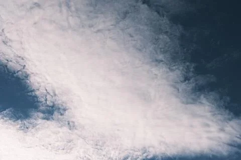 Blue sky with white fluffy clouds, beautiful dark heaven Stock Photos