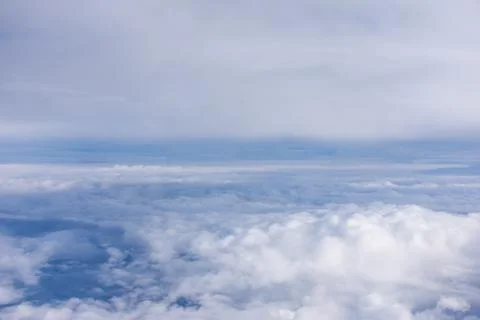 Blue sky with white fluffy clouds Stock Photos