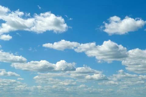 Blue sky with white fluffy clouds. Scenic view of bright atmosphere with su.. Photos