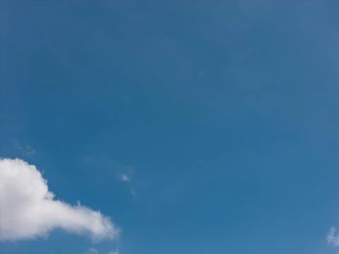Blue sky with white fluffy clouds on a sunny day Stock Photos