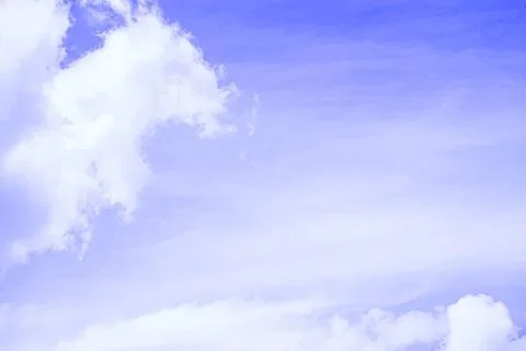 Blue sky with white fluffy clouds on a clear day Stock Photos