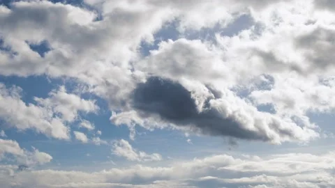 Blue sky, white-gray clouds. Fluffy fluffy clouds. Cumulus clouds cloudscape tim Stock Footage 233897029