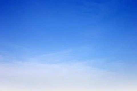 Blue sky with white, soft clouds Stock Photos