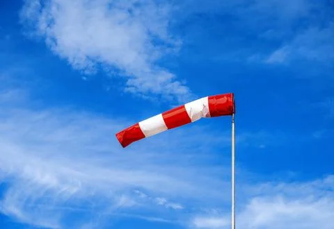 Blue sky with a wind indicator Stock Photos