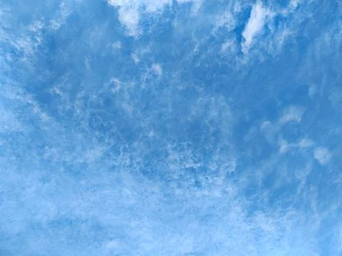Blue sky with wispy cirrus clouds Stock Photos