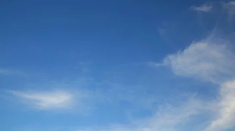 Blue sky with wispy clouds creating a serene and peaceful atmosphere Stock Photos