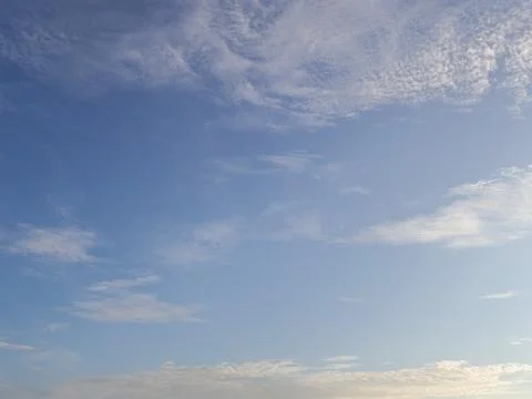 Blue Sky with Wispy Clouds Drifting Gently in Daylight with Natural Light, .. 写真素材