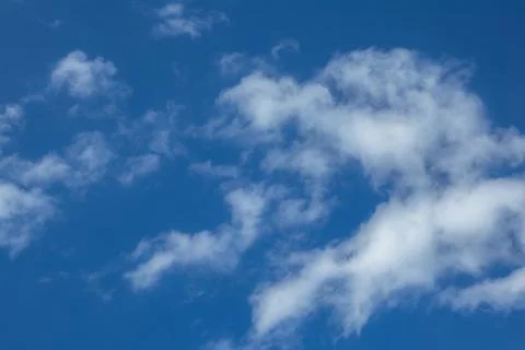 Blue Sky With Wispy White Clouds Stock Photos