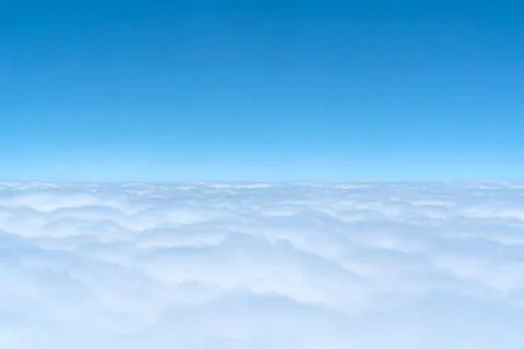 Blue skyline and cloudscape, view of the airplane window Stock Photos