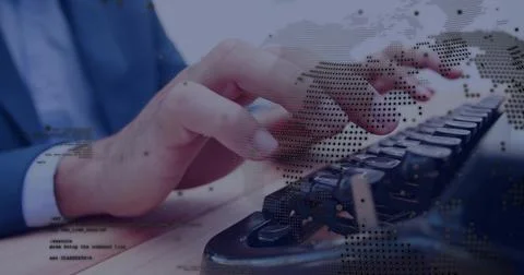 Blue-sleeved hands typing code on mechanical keyboard at office desk, with world Stock Photos