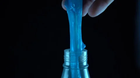 Blue slime dropping into bottle Stock Footage 127225419