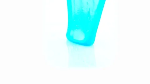 Blue slime running down white background Video stock 123855859