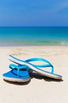 Blue slippers on the beach Stock-Fotos