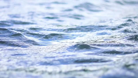 Blue slow-mo water surface gently moving on summer day Stock Footage 84804151