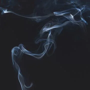 Blue smoke on dark background Stock Photos