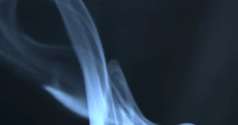 Blue smoke floating through space against black background Stock Footage 106878293