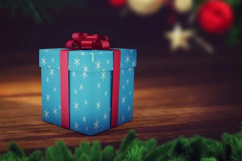 Blue snowflake gift box is sitting on tabletop in flat design, with red ribbon Illustrazione stock