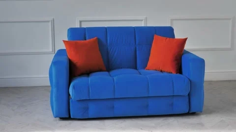 Blue sofa with red pillows in the interior Stock Footage 163750260