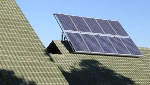 Blue Solar Panel Rack System on Green Tile Roof  (HD) Stock Footage 8895879