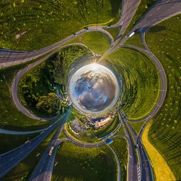 Blue sphere of sky with clouds overlooking old town, urban development, histo Stock Photos