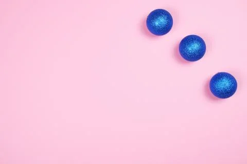 Blue spheres on pink background. Stock Photos