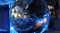 Blue spinning glitterball on dancefloor HD Footage