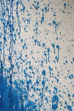 Blue splash on cement wall texture background Fotos de archivo