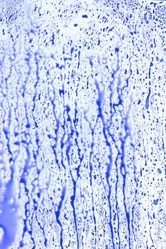 Blue splatter on white surface Stock Photos