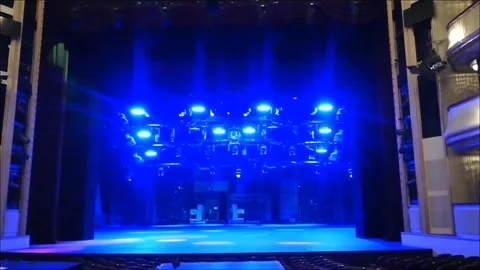 Blue spotlights on a empty stage with light effects Stock Footage 262083815