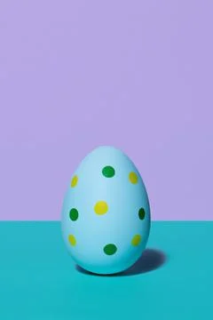 A blue spotted Easter egg in 80s-90s retro style. Stock Photos