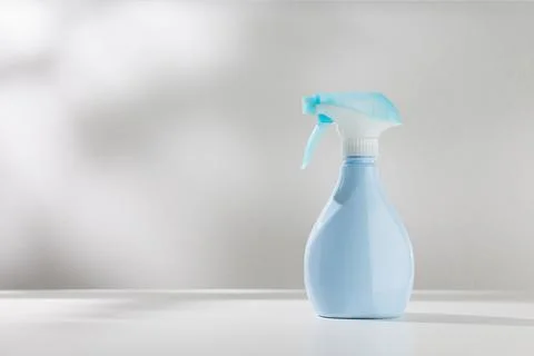 Blue spray bottle Stock Photos
