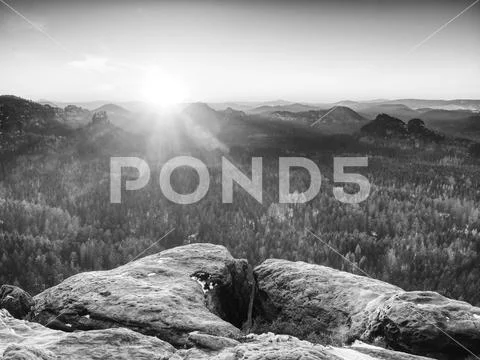 Blue spring daybreak, thawing of last snow. Sandstone cliff Stock Photos