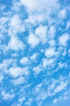 Blue spring sky with white clouds Stock Photos