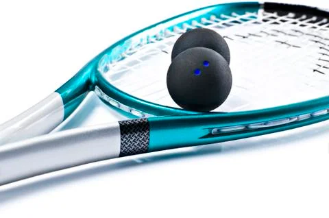 Blue squash racket with balls on white Stock Photos