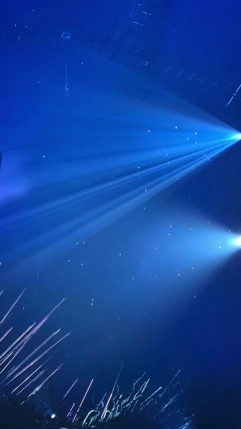 Blue Stage Lighting with Beams and Sparkling Particles Stock Footage 285647495