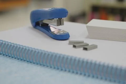 Blue stapler and staples Stock Photos