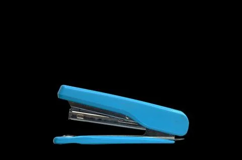 Blue stapler  on black background, clipping path including Stock Photos
