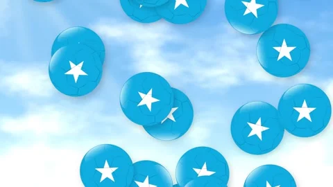 Blue Star Patterned Soccer Balls Falling Through a Cloudy Sky Stock Footage 340012715