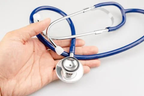 Blue stethoscope with shadow isolated on white background - Image Stock Photos