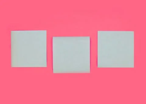 Blue stick note on pink background. Mock-up of blue empty office stickers on Stock Photos