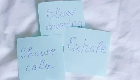 Blue sticky notes featuring handwritten messages about a slow morning, choosi Stock Photos