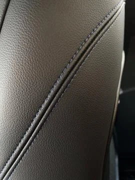 Blue stitching on black leather Stock Photos