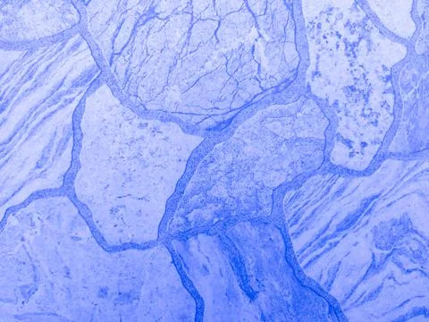 Blue stone tile with stone texture and scuffs. Blue vintage background.  Stock Photos