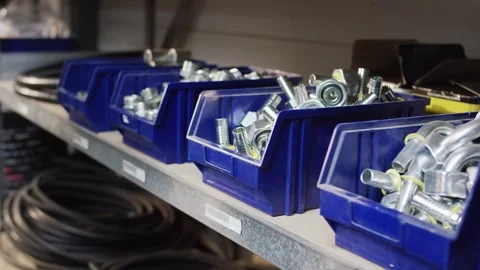 Blue Storage Bins Full of Metal Fittings on Workshop Shelf, Parts Inventory Stock Footage 340358369