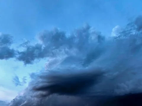 Blue Storm Cloud Formation Across Evening Sky 写真素材