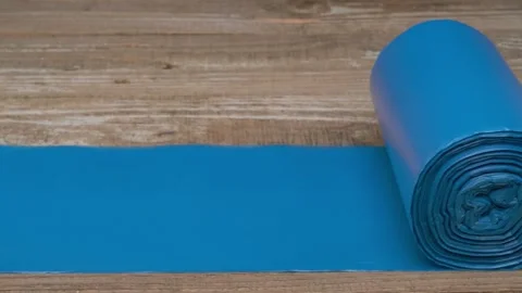 A Blue Stretch Band elegantly placed on a Wooden Surface for various fitness 動画素材 291287214