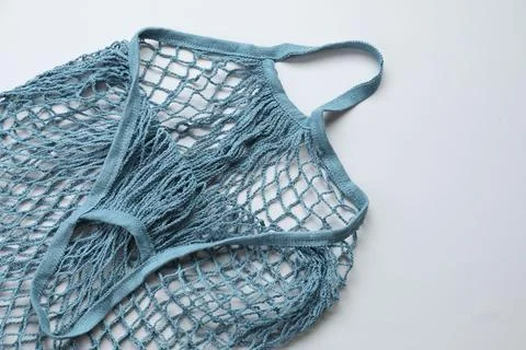 Blue string bag on light grey background, top view Stock Photos