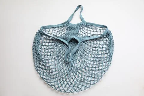 Blue string bag on light grey background, top view Stock Photos