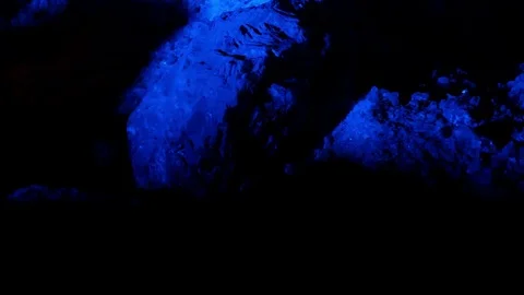 Blue strobe lights over rocks Stock Footage 80722372
