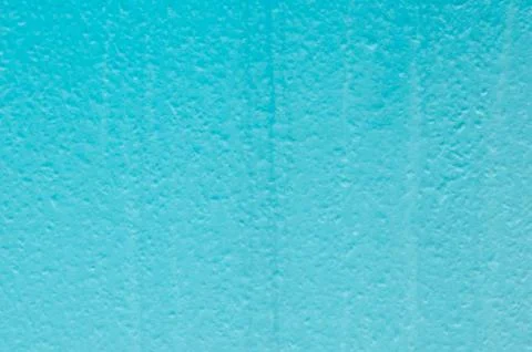 Blue structural painted wallpaper on the wall Stock Photos